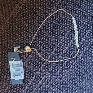 Lovely Nadri "diamonds" w "gold" chain Adjustable Braclet